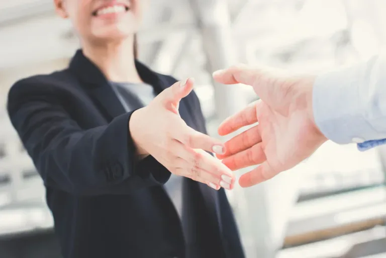 Business professionals shaking hands