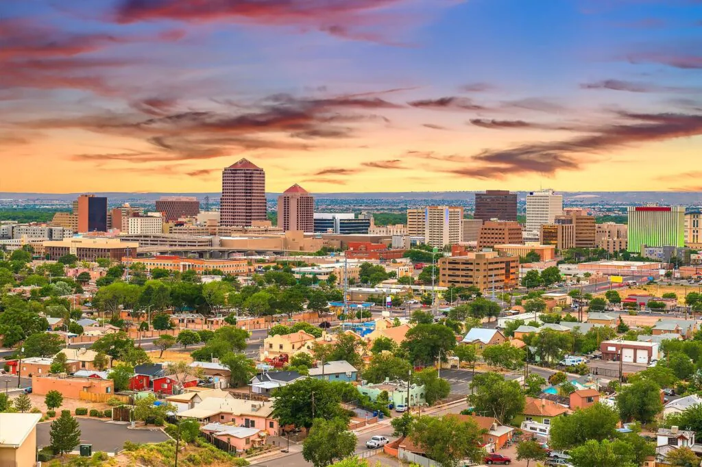 New Mexico city skyline and mountains at sunset