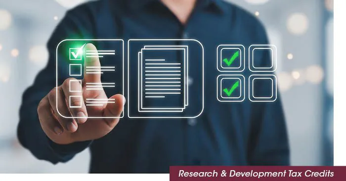 Hand selecting checkboxes on a digital research and development interface