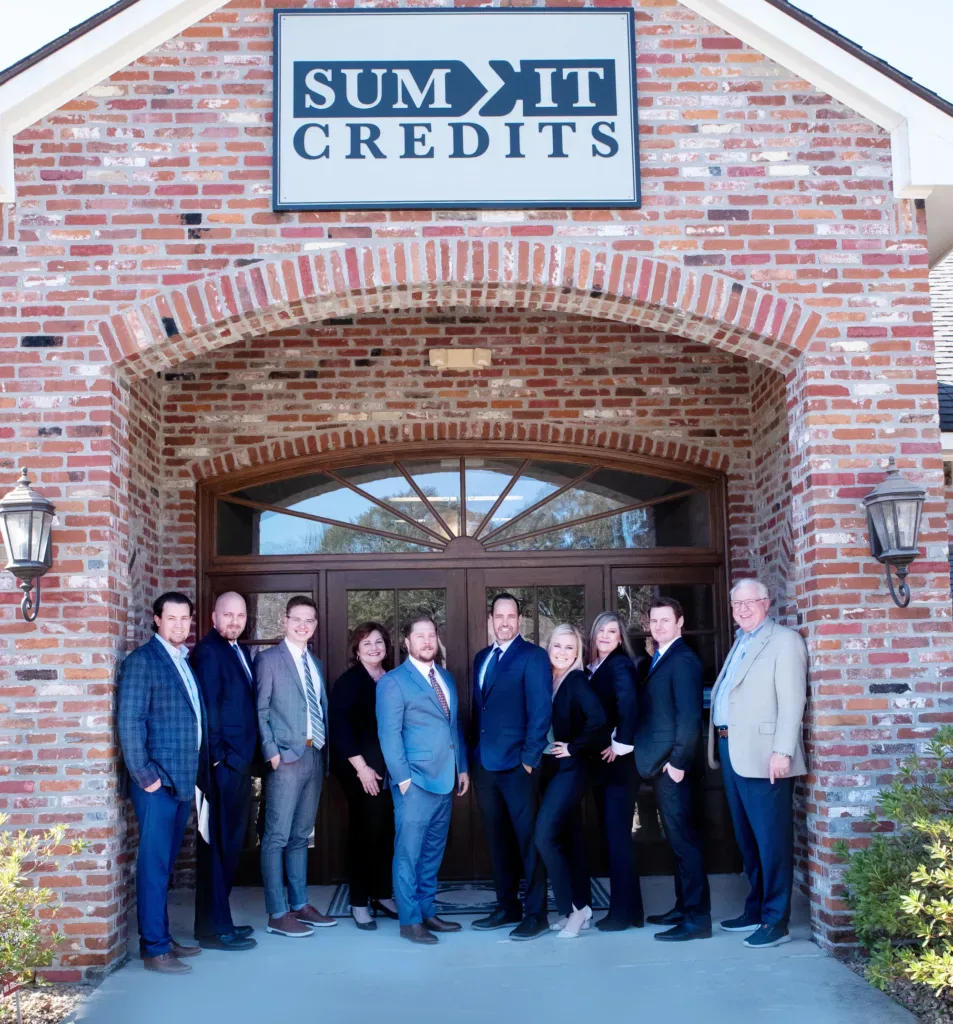 SumIt Credits team outside its Louisiana office